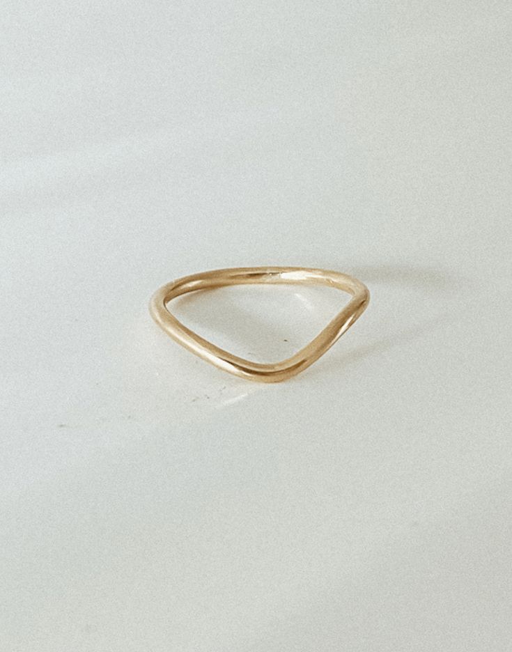 Our peak ring was made for stacking and is perfect if you’re looking for a simple band with an arch setting. Wear it as a thumb ring or stacked with our bold pearl ring. Handmade to order in 14k gold filled to withstand daily wear time after time. Tarnish-proof + safe to wear through hand-washing Classic Tarnish-resistant Open Stackable Rings, Minimalist Handmade Stackable Open Rings, Dainty Hammered Stackable Open Rings, Minimalist Hammered Gold Stackable Rings, Simple Band, Evil Eye Ring, Eye Ring, Thumb Rings, Pearl Ring