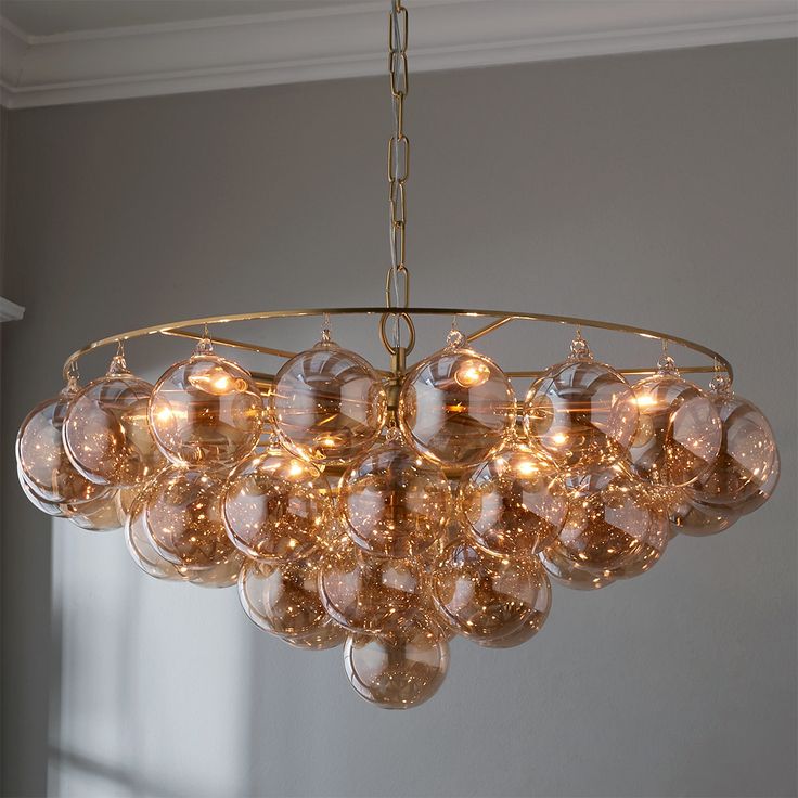 a chandelier hanging from a ceiling in a room