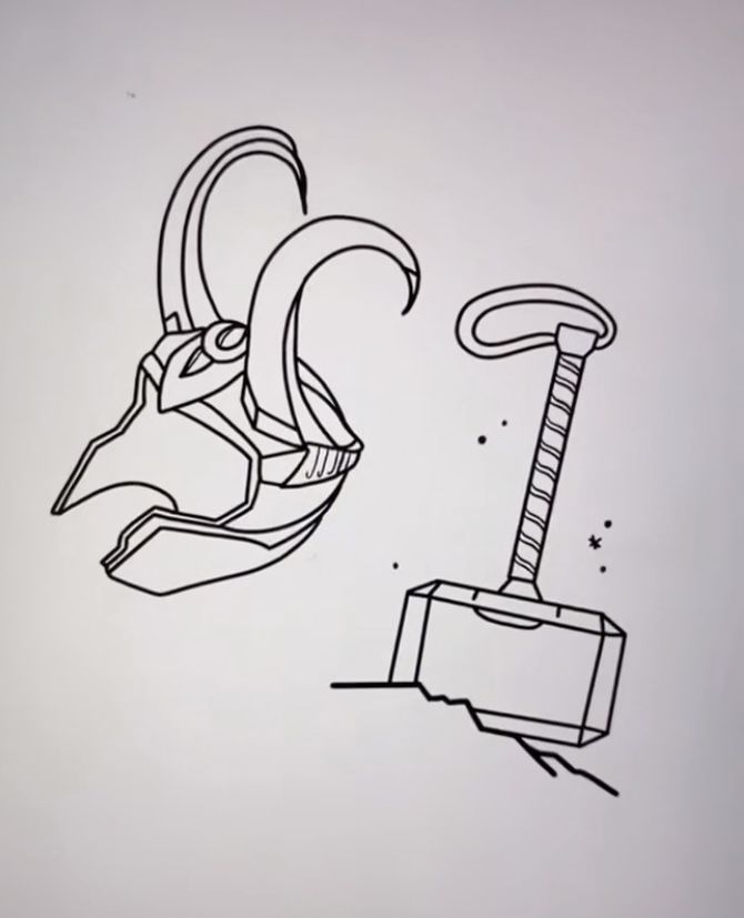 a drawing of an animal head next to a hammer