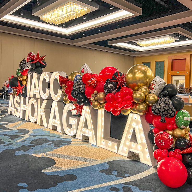 balloons are arranged in the shape of letters that spell out aco ashgaalaa