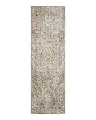 a rug with an old fashion look on the bottom, and a faded design on the top