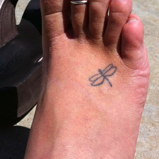 a person with a small tattoo on their foot