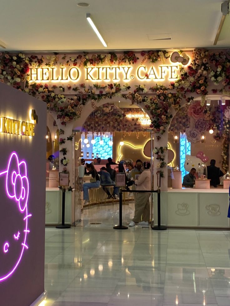 the hello kitty cafe is decorated with flowers