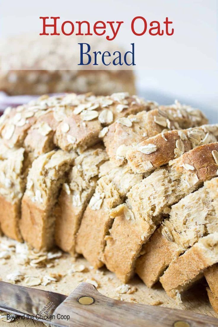 a loaf of honey oat bread sitting on top of a cutting board