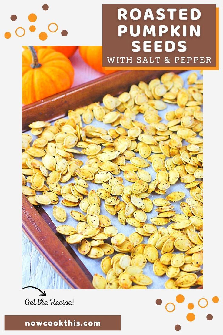 roasted pumpkin seeds with salt and pepper on a baking sheet next to some pumpkins