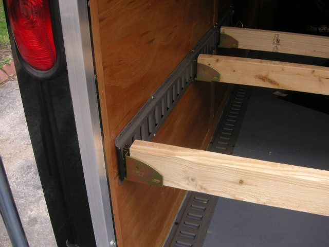 the back end of a truck with wooden steps