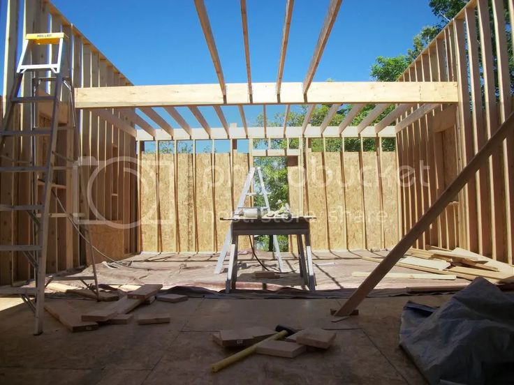 the inside of a house being built with wooden framing