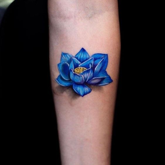 a blue flower tattoo on the arm