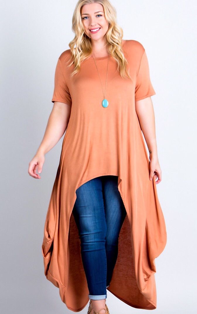 You will steal the show in this stunning tunic! These have always been best sellers, because they are SO incredibly comfy and flattering on every figure! High low style looks gorgeous paired with your favorite denim or white skinnies! Excellent quality knit in this beautiful spicy bronze color is gorgeous for fall! **Pic of olive included to show fit on all sizes. Runs a tad large. If in between, choose your smaller size. Small 4-6, Medium 8-10, Large 12-14, 1X 16-18, 2X 20-22, 3X 24-26 Length 5 Casual Stretch Tunic, Casual Fitted Tunic With Asymmetrical Hem, Casual Stretch Tunic For Spring, Casual Fall Tunic, Casual Tunic For Fall Layering, Casual Stretch Tunic For Fall, Fall Layering Tops With High-low Hem, Casual Flowy Tops With Asymmetrical Hem, Casual High-low Hem Top For Layering