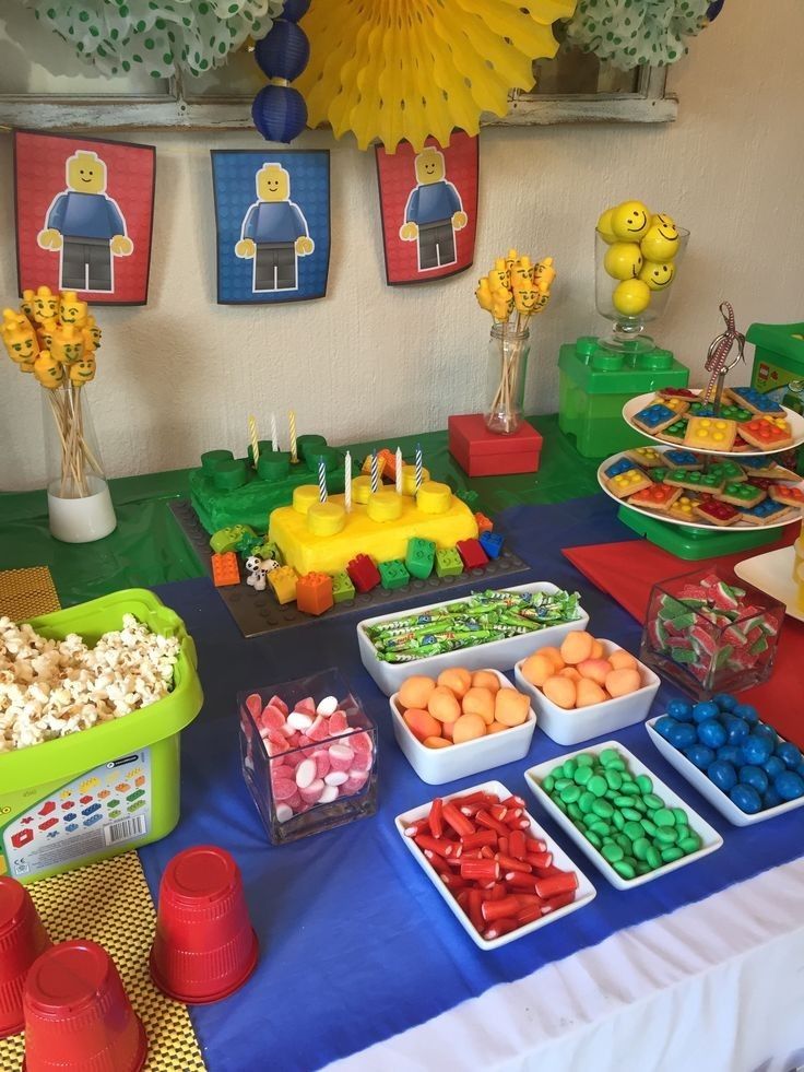 a table topped with lots of different types of candy and candies on top of it