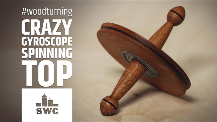 a wooden spinning toy with the words crazy gyroscope spinning top on it