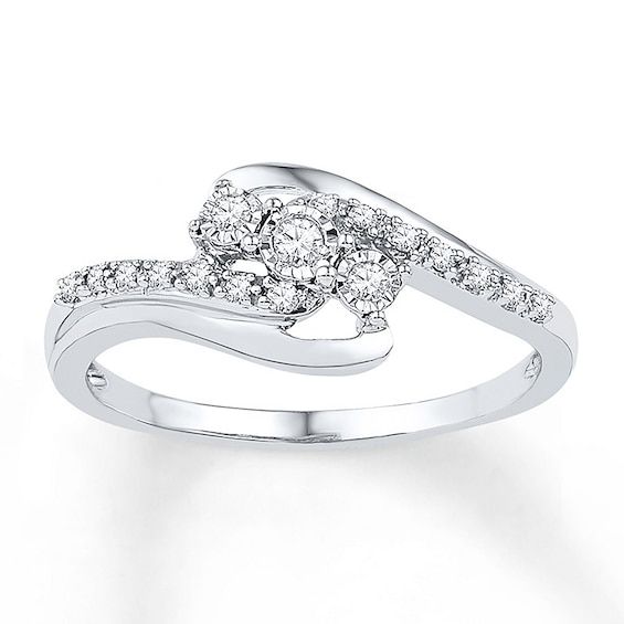 a white gold ring with diamonds on it