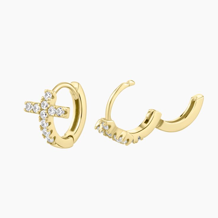 These elegant gold-plated sterling silver huggie earrings feature a beautiful cross design, making them a perfect addition to any jewelry collection. The warm gold tone of the sterling silver setting adds sophistication to the overall design, while the huggie style ensures a snug and secure fit, gracefully hugging the earlobe. These versatile and stylish cross huggie earrings are suitable for both casual and formal occasions, adding a touch of elegance and spirituality to any outfit. Elegant Gold Cross Hoop Earrings, Silver Huggie Earrings, Huggie Earrings Silver, Beautiful Cross, Cross Design, Huggie Earrings, Cross Designs, Huggies Earrings, Gold Plated Sterling Silver