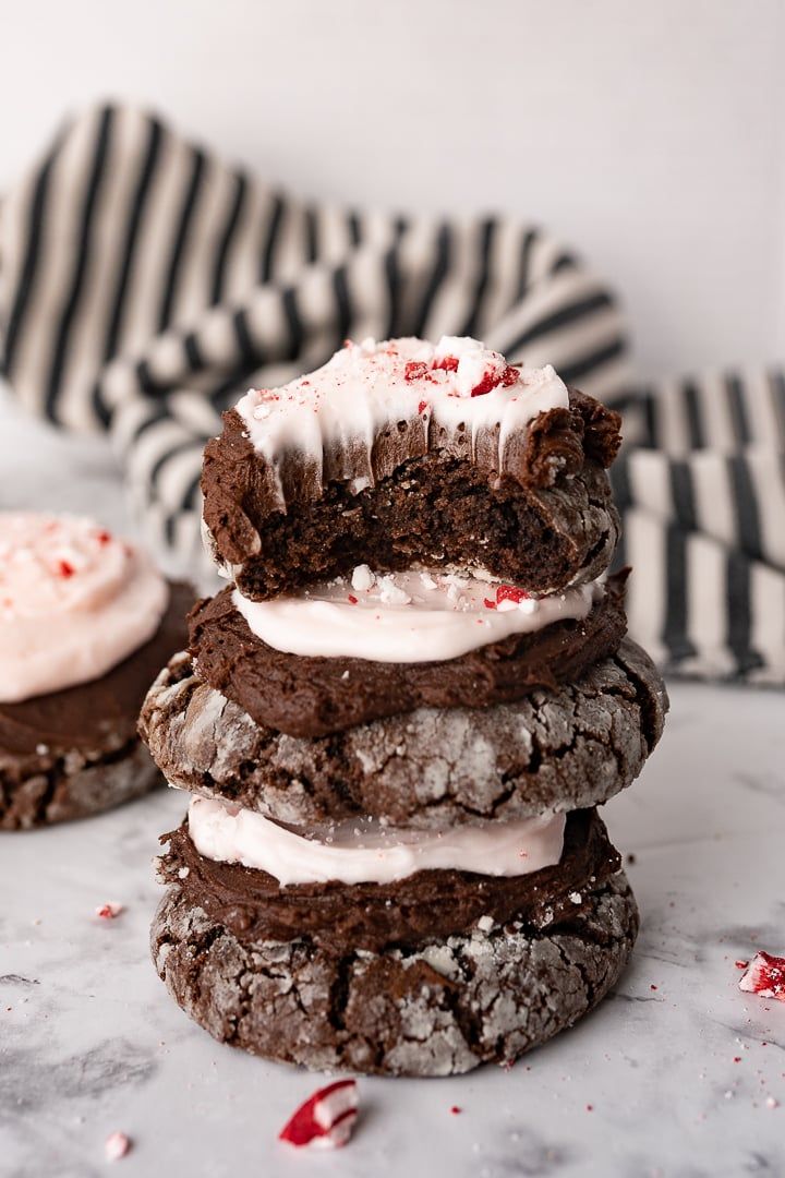 three cookies stacked on top of each other with white frosting