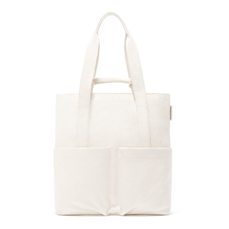 Everyone has a favorite pair of jeans. Ours just happens to come in the form of a bag. Meet the Pacific Tote. Made from 100% organic cotton canvas, this tall tote bag is your perfect (and stylish) partner in crime—especially if those crimes include beach days, grocery runs, and a trip to the gym. But make no mistake, the Pacific Tote is great for work too. It even fits a 13” laptop and has pockets for your phone and small tablet (and even more pockets for the billions of cords you need to make e Casual Bags With Flat Pocket For On-the-go, Practical Everyday Canvas Bag With Canvas Lining, Casual Cotton Bag With Large Capacity, Casual Large Capacity Cotton Bag, Versatile Cotton Shoulder Bag With Zipper Pocket, Casual Cotton Bag With Double Handle, Casual Cotton Tote Shoulder Bag, Eco-friendly Large Capacity Canvas Bag For On-the-go, Summer Canvas Bag For On-the-go