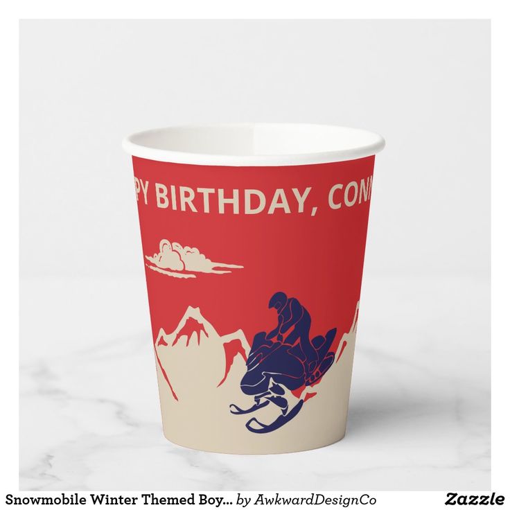 a red and white cup with an image of a man riding a snowboard on it