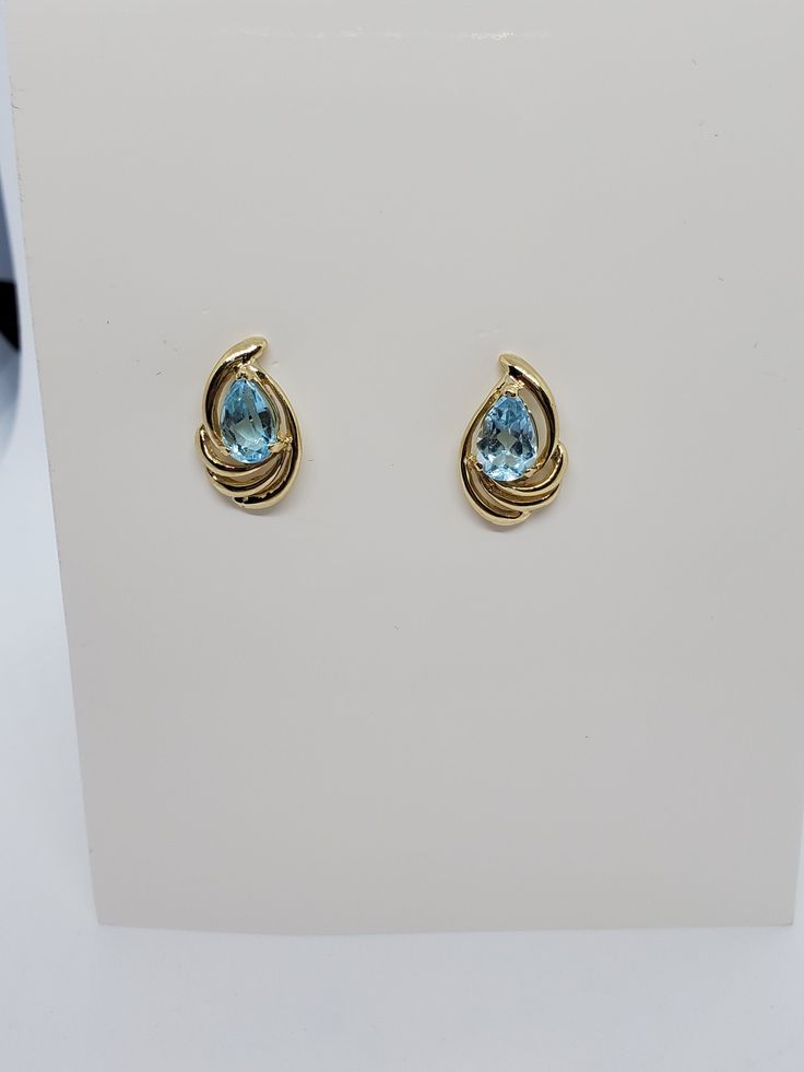 You are viewing a beautiful 14k solid gold topaz earrings. Pierced styleback. The total weight of the earrings approx.3.08 grams. Each earrings measures approx.17mm x 1mm wide. Marked 14k at the back. The earrings is in good condition. Fine Jewelry Topaz Birthstone Earrings, Fine Jewelry Birthstone Earrings In Topaz, Topaz Birthstone Earrings, Formal Round Topaz Earrings, Formal Blue Topaz Diamond Earrings Fine Jewelry, Formal Blue Topaz Diamond Earrings, Blue Oval 14k Gold Earrings, Oval Blue 14k Gold Earrings, Anniversary Topaz Gemstone Earrings