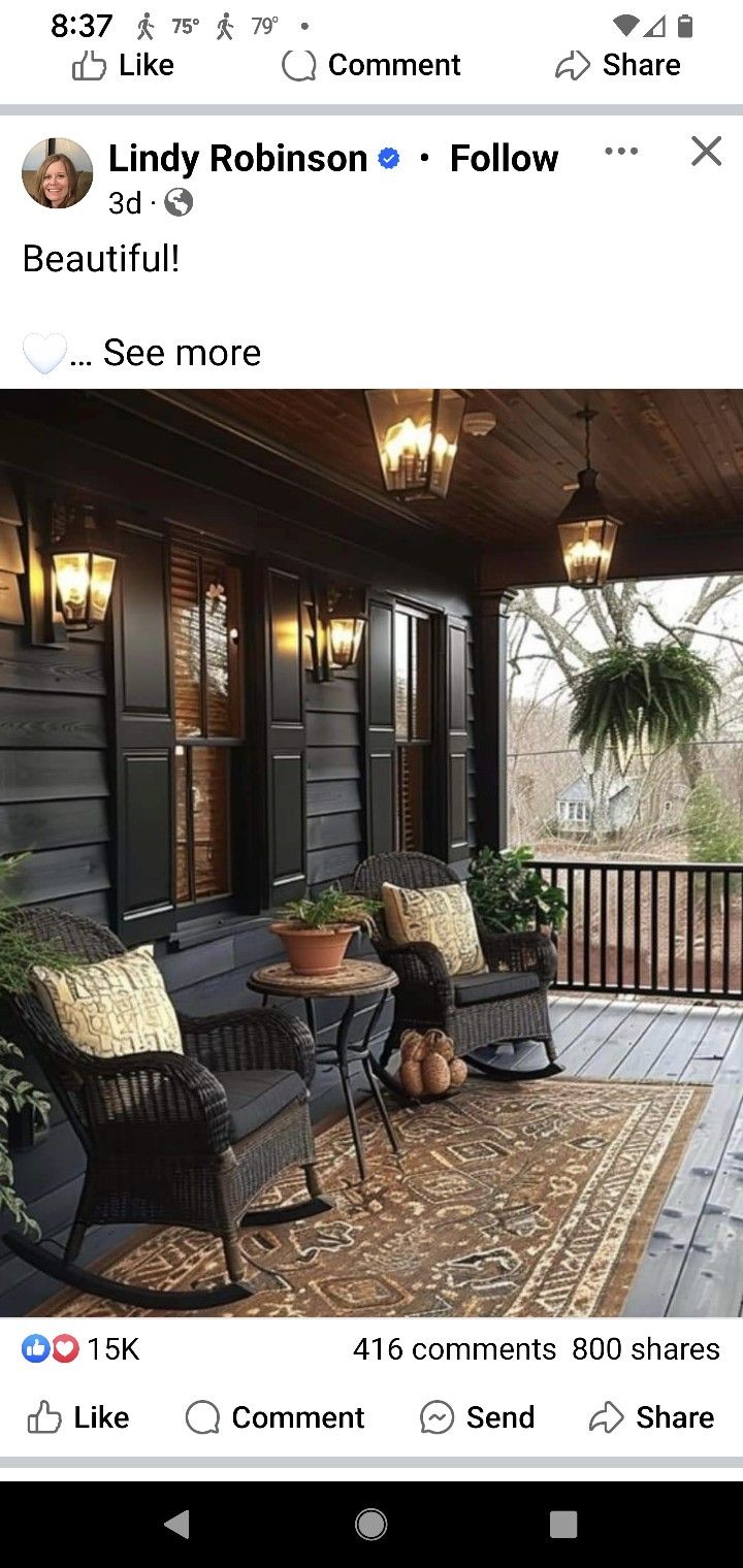 an image of a porch with furniture on the front and back sides, including two wicker chairs