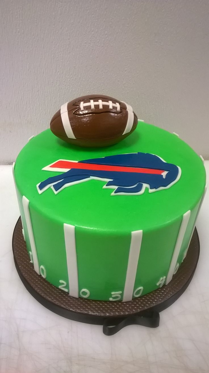 a green cake with a football on top