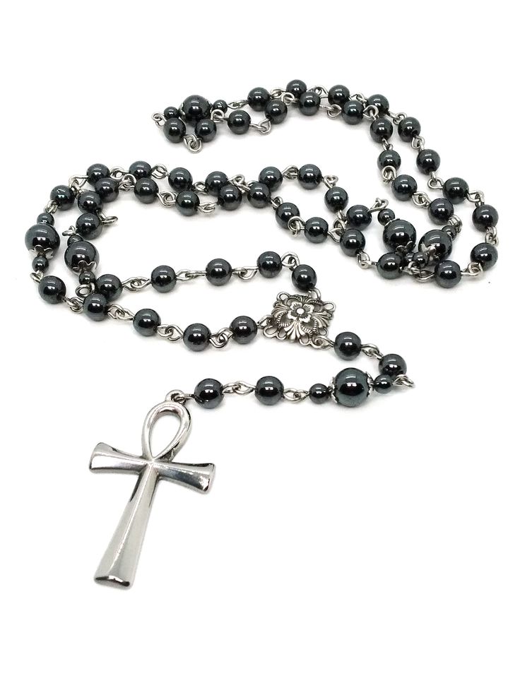 Made to Order! Available in rosary form at long last! An enduring staple of the goth subculture, this ankh rosary is a goth jewelry cornerstone for your wardrobe. The chain construction is kept simple to allow the pendant to shine. This ankh is made of stainless steel and will not tarnish over time. The sturdy construction and simple beauty of this rosary make a reliable piece that you won't want to leave home without. The shiny steel will contrast perfectly with all manner of gothic attire. At Gothic Rosary Necklace, Trad Goth Jewelry, Trad Goth Clothes, Ankh Rosary, Goth Accessories Jewellery, Gothic Baddie, Goth Rosary, Gothic Accessories Jewellery, Baddie Jewelry