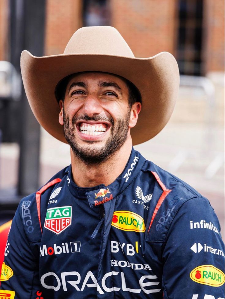 a man wearing a cowboy hat and smiling