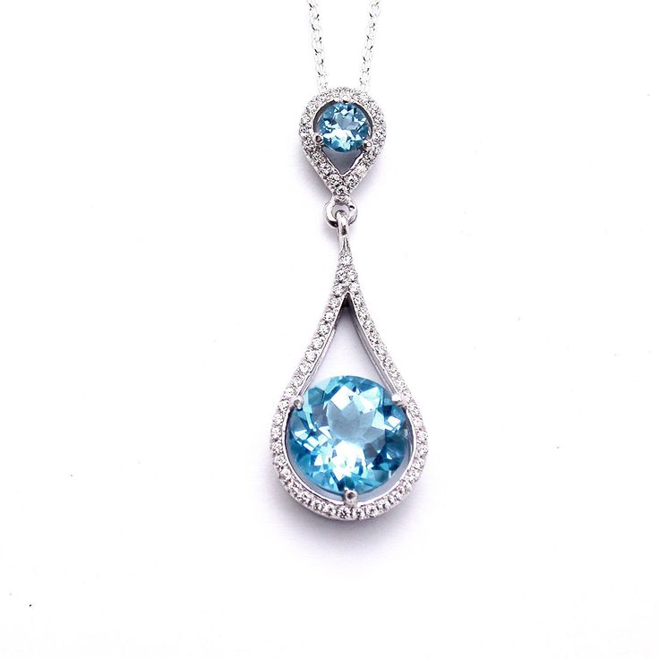 Gold & diamond Blue Topaz pendant necklace, made of white gold and set with center Blue Topaz & diamonds, Can become an incredible gift to your lovely person. Classic pendant, great present . Summer collection. Gemstone: Blue Topaz - 2 pc. Diamond- 51 pc. - total 0.27 carats Metal: White Gold 14k Available metals: Yellow Gold 14k Weight: 4.00 gram Catalog code: PH-4061WS Condition: New Designer: Cohen Jewellers Free shipping 1-3 business days shipping Formal Blue Topaz Drop Necklace, Fine Jewelry Blue Topaz With Pave Setting, Blue Topaz Jewelry With Pave Setting For Anniversary, Blue Drop Jewelry With Diamond Accents, White Gold Necklace With Diamond Accents And Blue Topaz, Dazzling Blue Jewelry With Pave Setting, Anniversary Aquamarine Necklace In White Gold, Anniversary Aquamarine White Gold Necklace, Anniversary White Gold Aquamarine Necklace