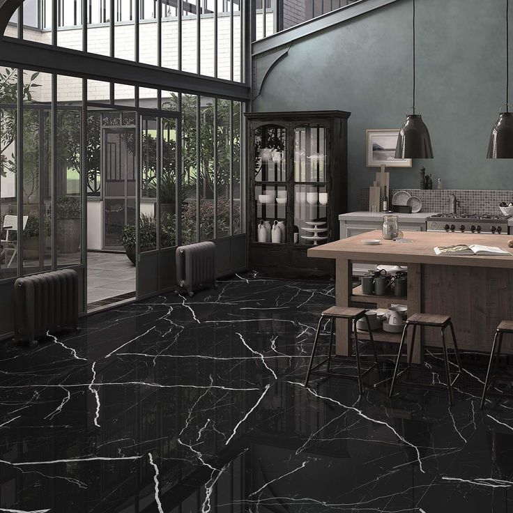 a kitchen with black marble floors and walls