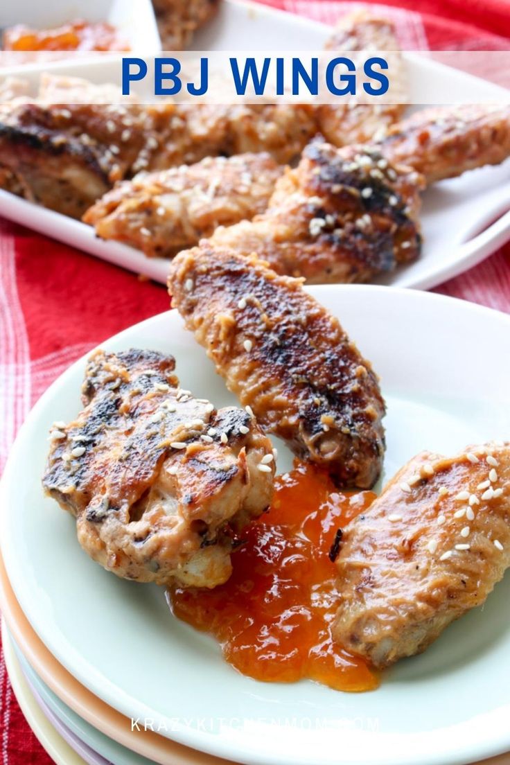 grilled pork chops with bbq sauce on a white plate and red checkered table cloth