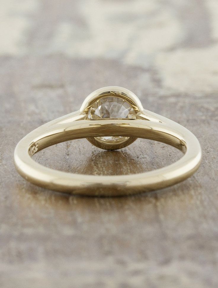 The Rowan engagement ring by Ken & Dana Design is the epitome of simple elegance in a bezel setting. This ethereal piece is created with recycled metals and blends harmoniously with a bezel-set round center stone. She is ideal for the woman who prefers a minimal and modern engagement ring! Approx Production Time: 4-5 weeks Drop-down diamond options represent our recommended grade, which maximizes size for value, while maintaining eye-perfect clarity and giving you a colorless look. For other dia Minimal Engagement Ring, Solitaire Engagement Ring Cathedral, Modern Engagement Ring, Cathedral Engagement Ring, Cathedral Ring, Cathedral Engagement Rings, Bezel Engagement Ring, Lab Diamond Engagement Ring, Bezel Set Ring