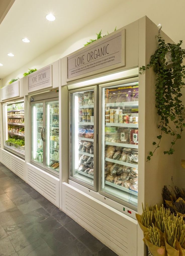 the inside of a grocery store filled with lots of food and veggies on display