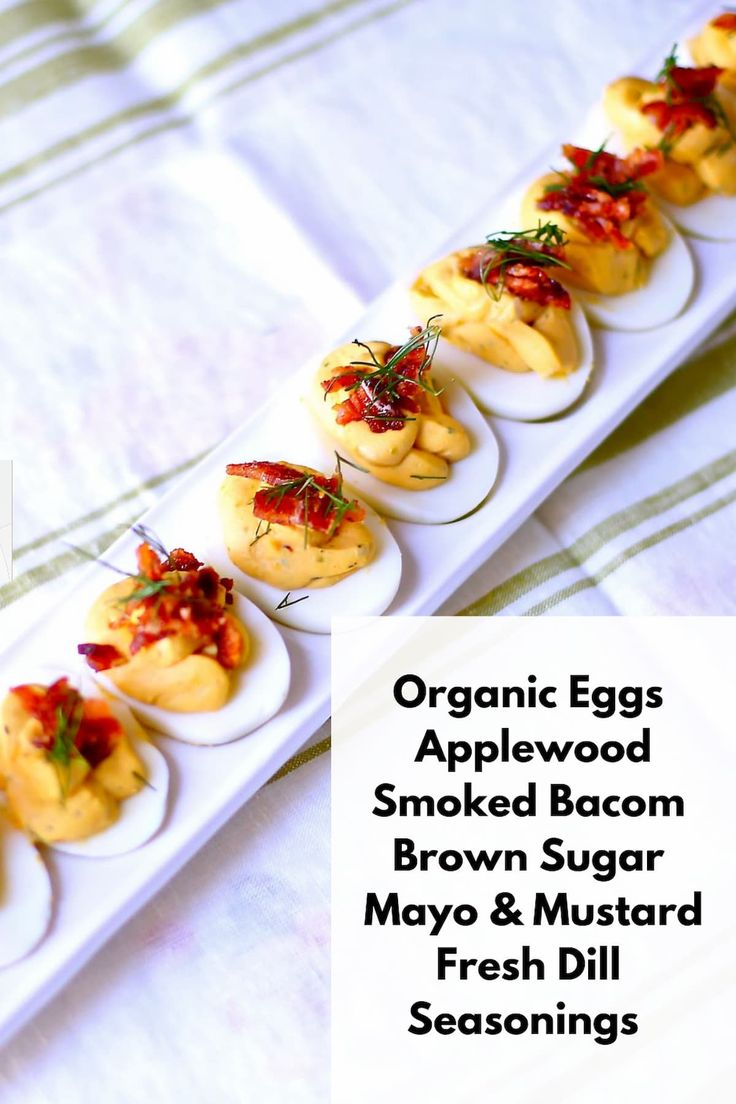 there are many small appetizers on the plate with text overlay that reads organic eggs applewood smoked bacon brown sugar mayo