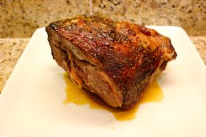 a piece of meat sitting on top of a white plate