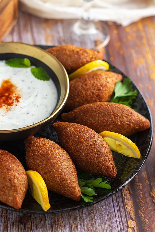 some food is on a plate and ready to be eaten with cream sauce in the background