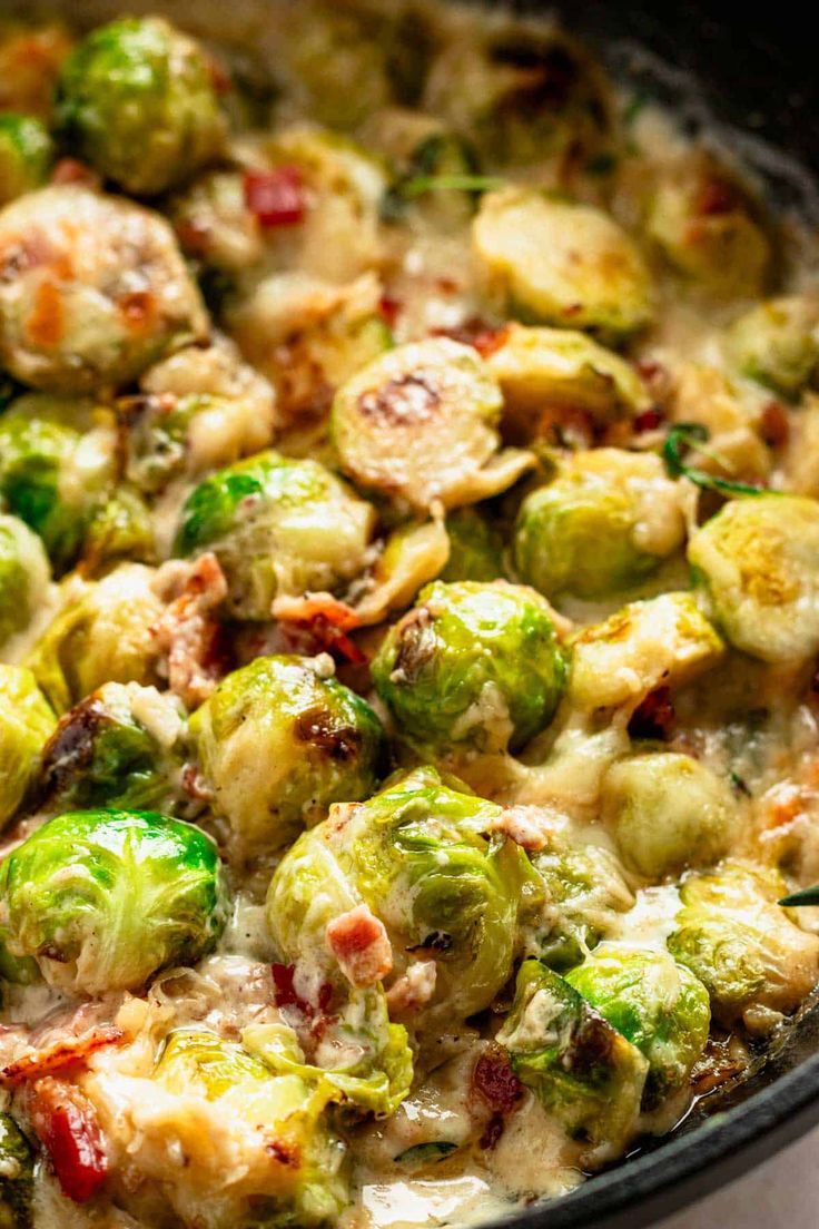 brussel sprouts with bacon and cheese in a skillet