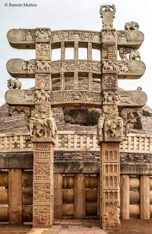 an intricately carved stone structure with elephants on it