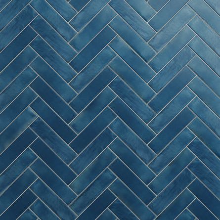 a blue tile wall with herringle pattern