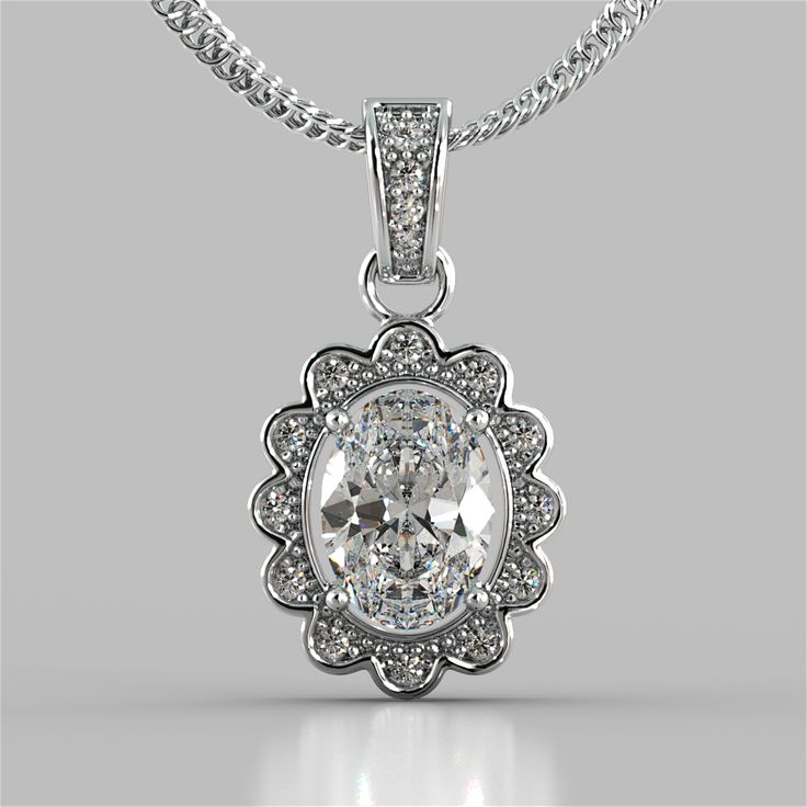 Add some glamour to your look with this captivating pendant. A gorgeous 1.5Ct Oval Cut simulated diamond center stone is set in a halo that is blooming like a flower.  Pendant features a further embellished simulated diamond bail slide that always sits flush on your décolleté. Elegant and feminine this pendant is sure to impress. Oval Cut Halo Pendant Center Stone: 1.5 CT Total Carat Weight: 1.65 CTW Stone Clarity: VVS-1 Available in: 14K White Gold 16" 14K White Gold Chain Included Model: PD2500-WH Halo Necklace, White Gold Chains, Halo Pendant, Personalized Pendant, Mens Pendant, Oval Cut Diamond, 925 Sterling Silver Chain, Unique Pendant, Fine Jewellery Necklace