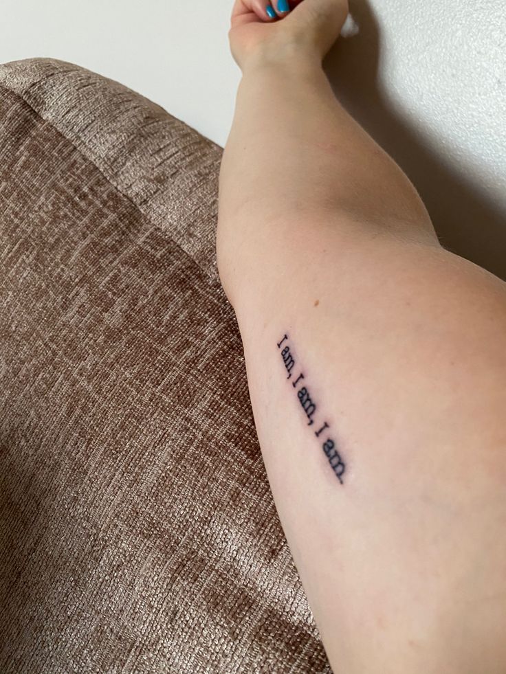 a woman's arm with a tattoo that reads, i love you and the words on it