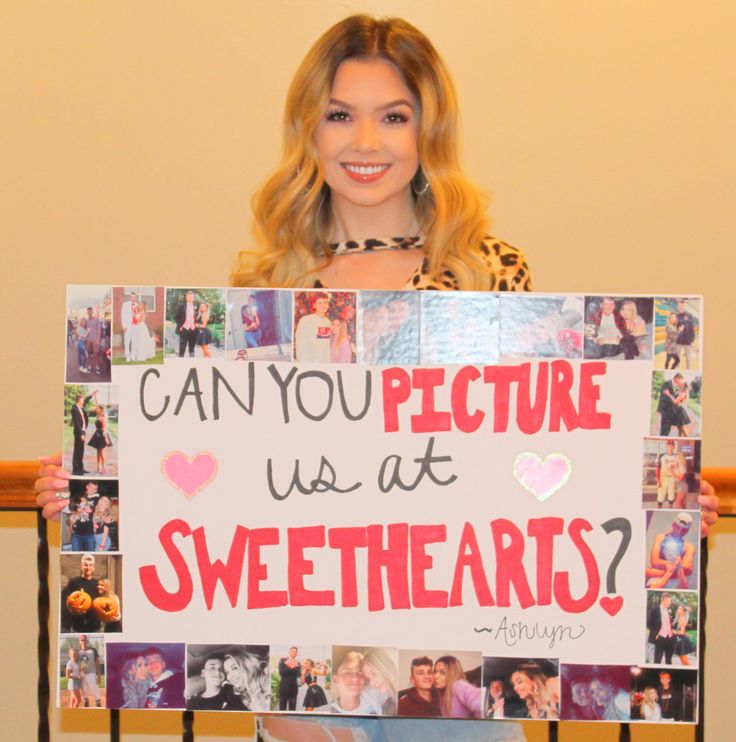 a woman holding up a sign that says can you picture us at sweethearts?