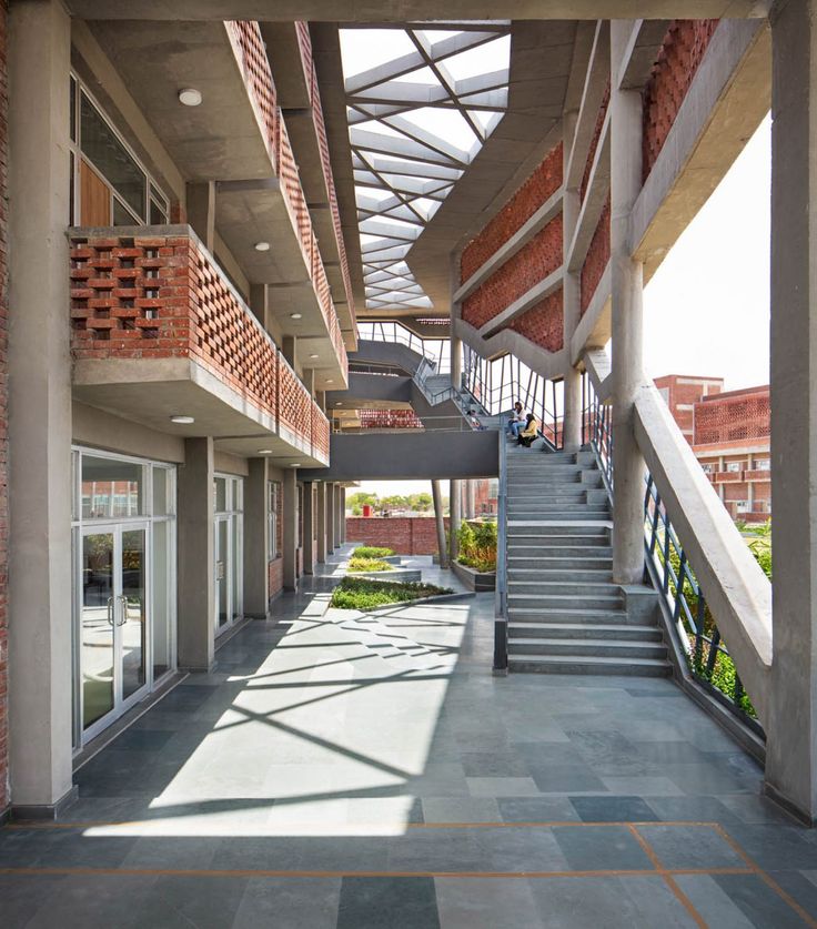 an empty building with stairs leading up to the second floor