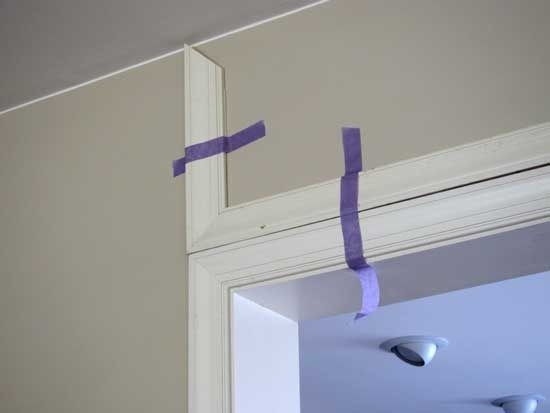 some purple tape is taped to the side of a door