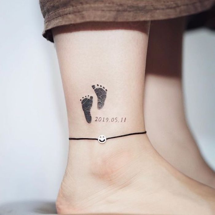 a woman's foot with a tattoo on her ankle that reads 2013 01 11