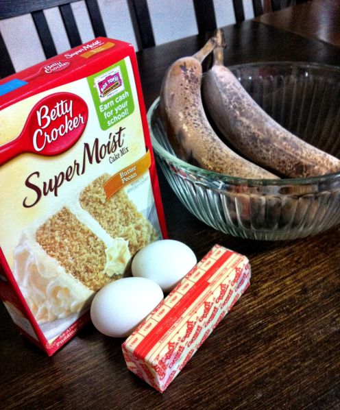 ingredients for banana bread sitting on a table next to an egg and milk carton