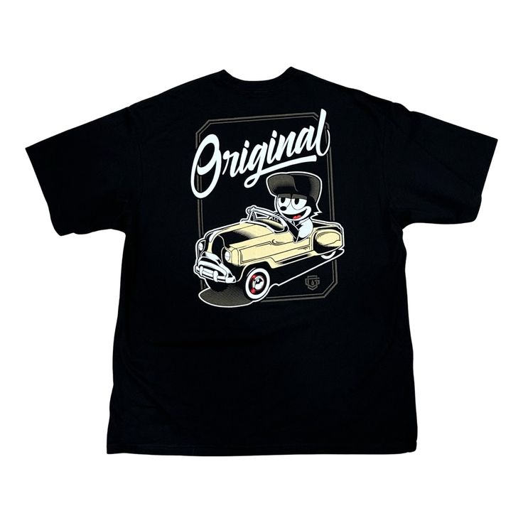 Design: Felix Pedal Car Design Location: Back of shirt Material: 100% Cotton Shirt Style: Short Sleeve Shirt Color: Black Print Process: Screen Print Brand: OG Family ALL SALES FINAL Retro Black Shirt With Front Print, Vintage Cotton Tops With Front And Back Print, Classic Short Sleeve Shirt With Graphic Print, Classic Graphic Print Short Sleeve Shirt, Classic Black Top With Graphic Print, Classic Crew Neck Shirt With Graphic Print, Classic Shirt With Graphic Print For Streetwear, Classic Graphic Print Shirt For Streetwear, Classic Graphic Print Tops For Streetwear