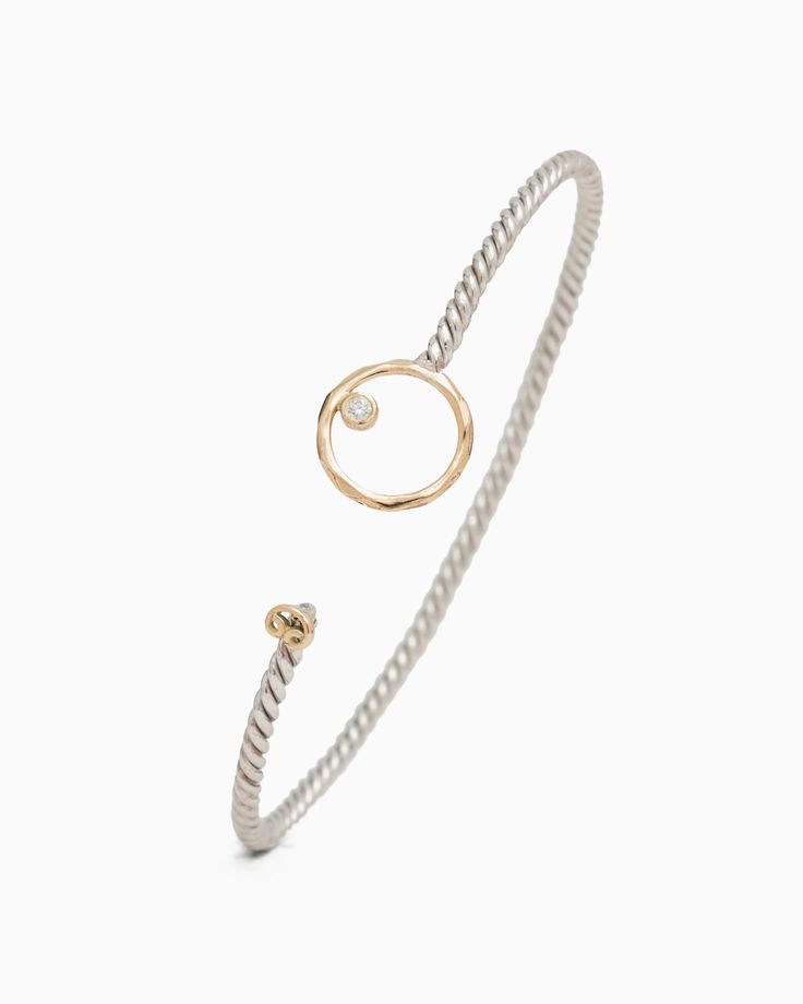 The One Love Twisted Hook Bracelet, gently hammered in sterling silver, features a twisted band, a 14K gold infinite circle and petroglyph, and a faceted diamond. Inspired by the boundless nature of love, this bracelet captures the spirit of the Caribbean, known for its friendly culture and warm embrace. Metal: Sterling silver with 14K gold accents Band Width: 2.5mm Circle Size: 12.5mm Stone Size: 2mm Style #: H96D White Gold Spiral Jewelry For Formal Occasions, Formal Spiral White Gold Jewelry, Adjustable Single Diamond Timeless Jewelry, Hammered Diamond Jewelry For Anniversary, Timeless Hammered Sterling Silver Jewelry, Handcrafted White Gold Fine Jewelry, Modern White Gold Jewelry With Diamond Accents, Modern Twist Spiral Jewelry For Anniversary, Modern Yellow Gold Jewelry With Single Cut Diamonds