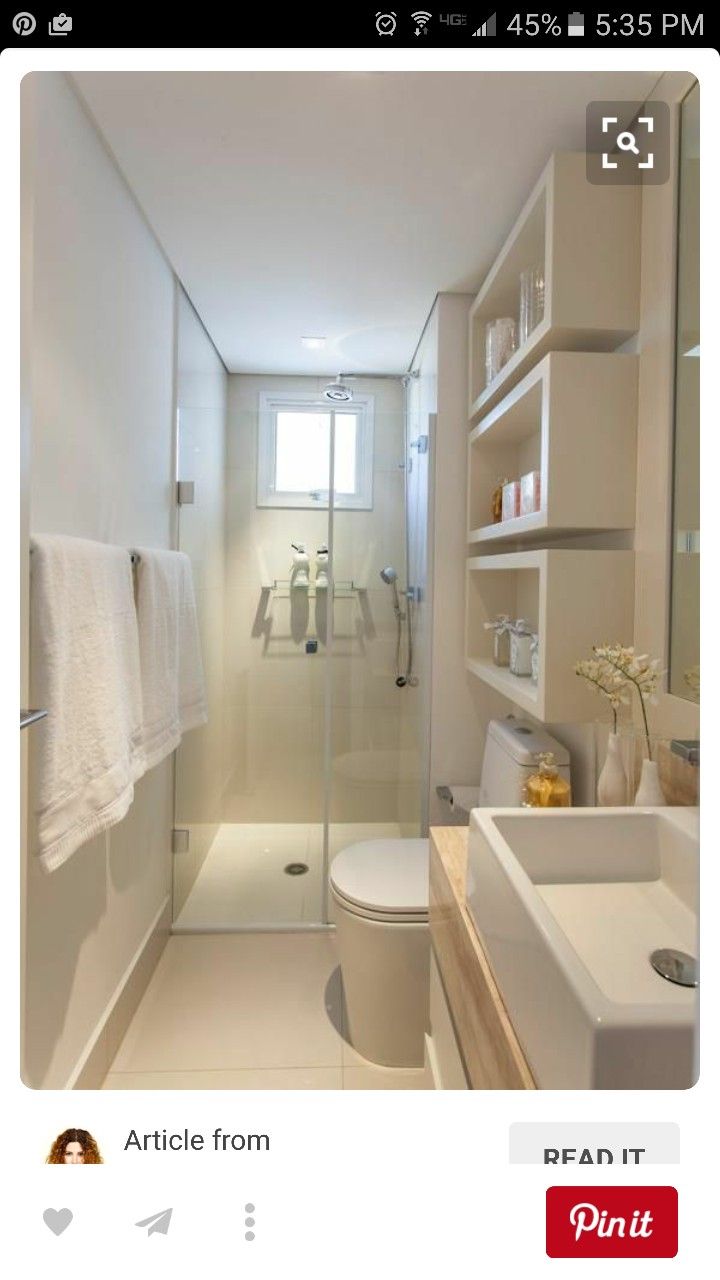 a bathroom with a toilet, sink and shower