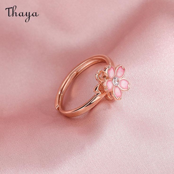 Capture the essence of cherry blossom season with our Silver Sakura Spinner Ring. This elegant piece tells a story of beauty and renewal, as delicate petals bloom and dance in the breeze. The spinner design allows for a soothing sensation, perfect for those seeking balance and serenity in their daily lives. Elevate your style with this stunning symbol of hope and new beginnings.   - Brand: Thaya  - Material: S925 Silver  - Weight : About 2.34g  - Size: Stack Mouth 14th  - Style: Flower  - Gender: Women Rose Gold Jewelry For Anniversary In Spring, Rose Gold Jewelry For Spring Anniversary, Delicate Jewelry For Anniversary In Spring, Delicate Jewelry For Spring Anniversary, Delicate Spring Jewelry For Anniversary, Rose Gold Ring For Spring, Spring Rose Gold Ring Jewelry, Spring Rose Gold Flower Jewelry, Spring Wedding Rose Gold Flower Ring