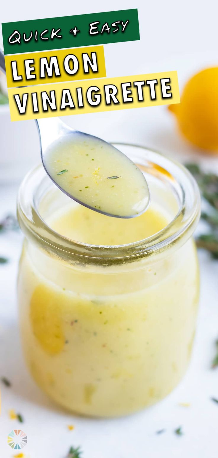 a spoon full of lemon vinaigrette on top of a jar