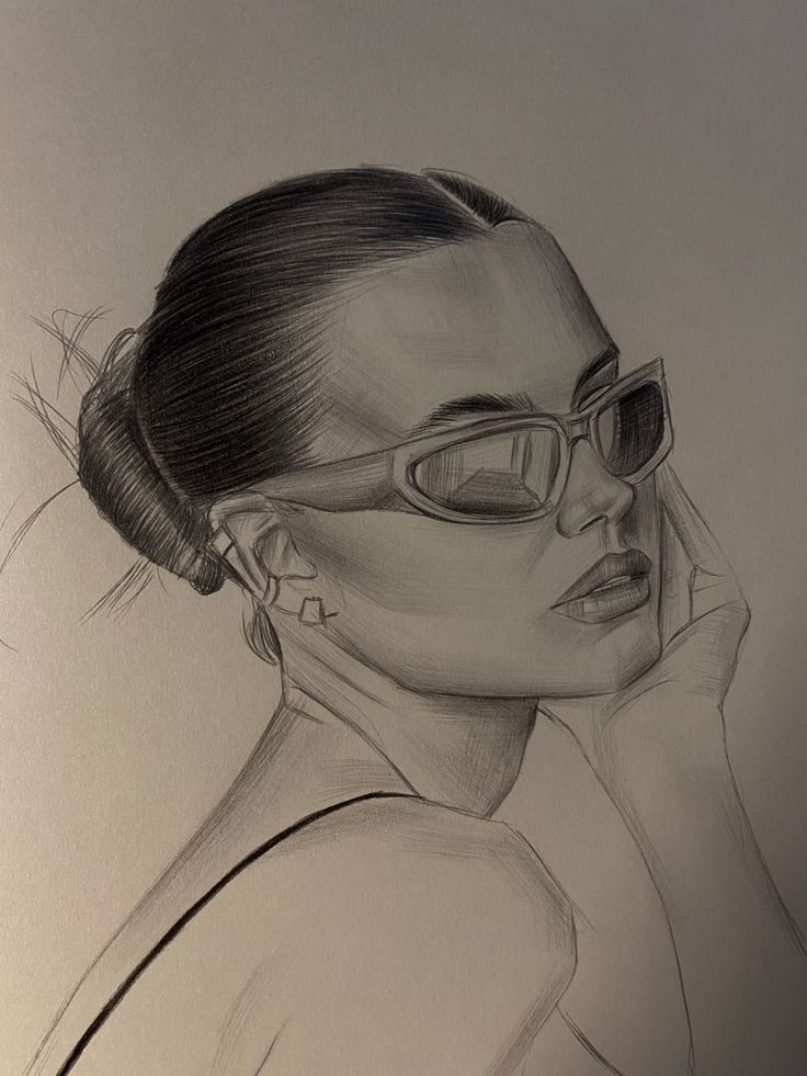 a pencil drawing of a woman wearing glasses