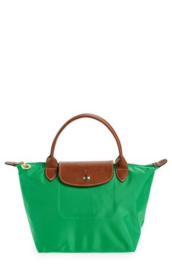 Lightly textured leather borders a durable, water-resistant nylon tote that folds into a small rectangle when not in use, making it perfect for travel. Top zip with snap-flap closure. Interior cell phone pocket. Water-resistant lining. Folds flat for storage. Nylon with leather trim. By Longchamp; imported. Handbags. Green Everyday Packable Shoulder Bag, Green Packable Travel Bag, Green Rectangular Packable Shoulder Bag, Everyday Green Packable Shoulder Bag, Green Packable Shoulder Bag For Travel, Everyday Packable Green Shoulder Bag, Green Packable Shoulder Bag For Everyday Use, Packable Green Shoulder Bag For Travel, Green Rectangular Packable Bag